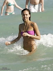 Warm waves washing bikini girl's sweet body