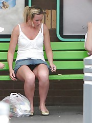 Upskirt sitting - blonde in mini at the bus stop