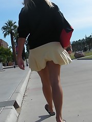 Young blonde in white mini on the street. Real upskirt upskirt shot