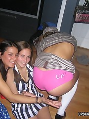 Two full booties hiding the strip of sexy string between upskirt photo