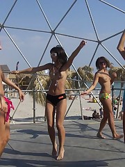 A busty bikini lady undressing on the Cap d'Agde candid upskirt