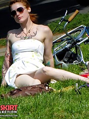 Tattooed redhead voyeured in a park. Sexy upskirt upskirt no panties