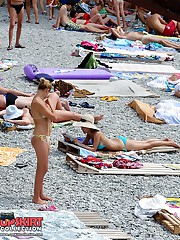Relaxing on the beach bikini babes upskirt photo
