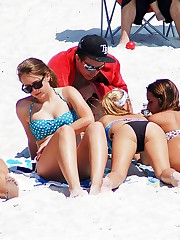 Bikini doll doing blowjob on beach upskirt picture