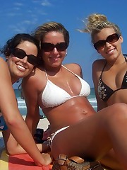 Girls in tiny panties sunbathing under the hot sun