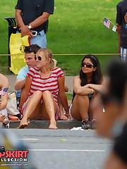 Upskirting. two ckicks in striped dresses