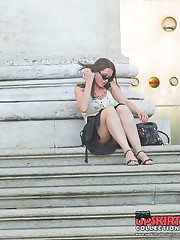Upskirts on stairs. Sexy cutie voyeured sitting
