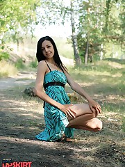 Girl lifts her skirt up a little bit